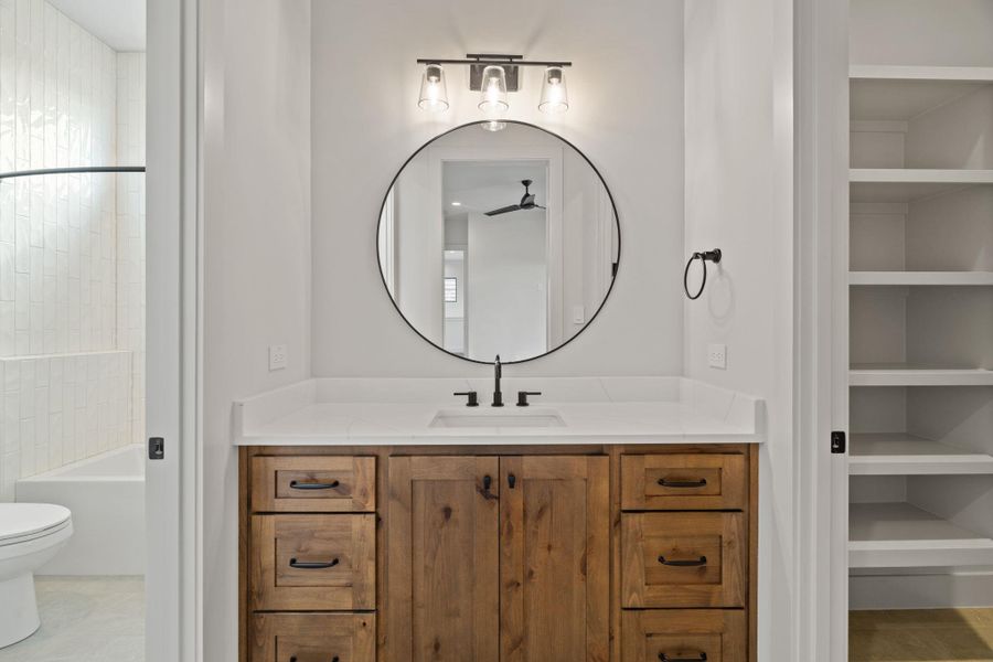 Bathroom vanity with closet connected to bedroom 2 out of 3 upstairs.