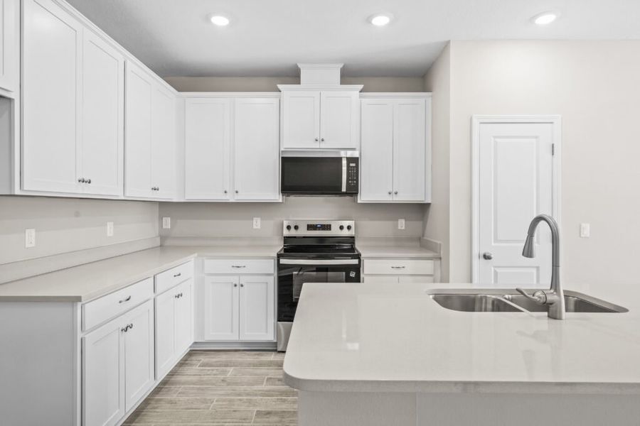 Furnished interior view inside a new home in Natureview, Freeport (Image 11).