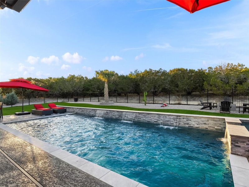 View of swimming pool featuring patio surround