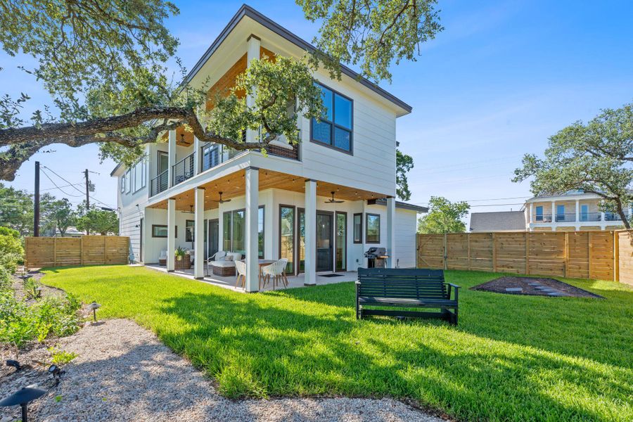 Outdoor space that feels peaceful and usable, a lush yard framed by Lake and Hill Country skies. Outdoor space that feels peaceful and usable, a lush yard framed by Lake and Hill Country skies.
