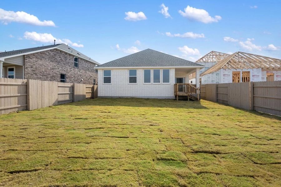 Exterior details and patio area of a home in The Colony, Bastrop (Image 26).