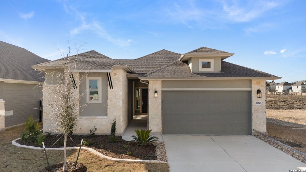 Front exterior of a new home in Davis Ranch, San Antonio, TX, highlighting curb appeal (Image 18).