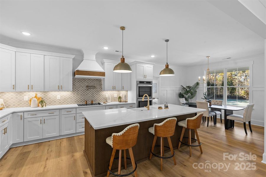 *representative photo- gourmet kitchen w/ custom wood hood vent, double oven, microwave built into the island, oversized level 3 quartz countertops, porcelain farmhouse sink