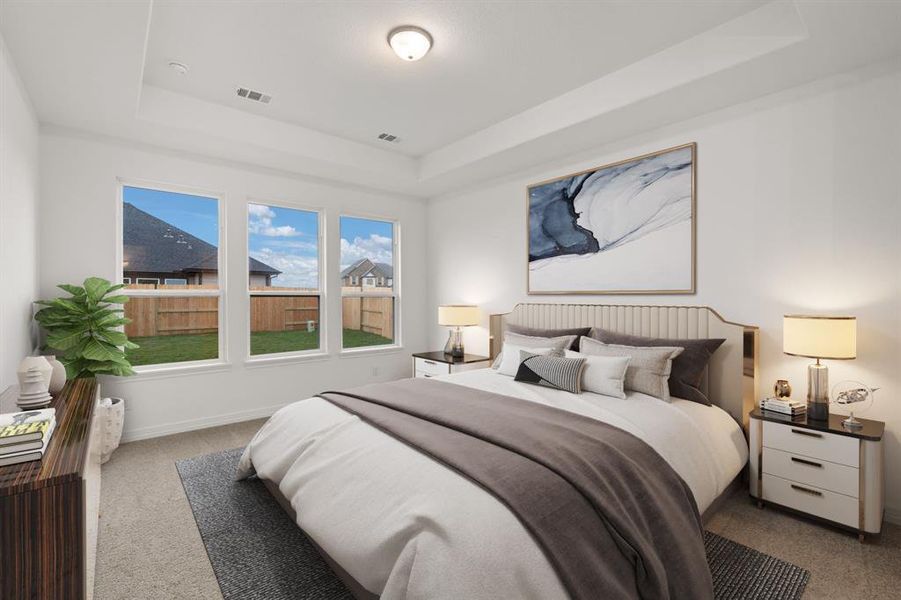 The primary bedroom is generously sized, creating a tranquil and spacious retreat that offers ample room for relaxation. Featuring plush carpet, high ceilings, fresh paint, and large windows that lets in natural lighting throughout the day.