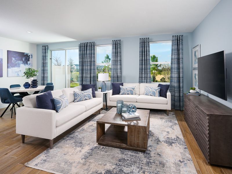 Living room in the Oakville floorplan modeled at Cagan Crossings West