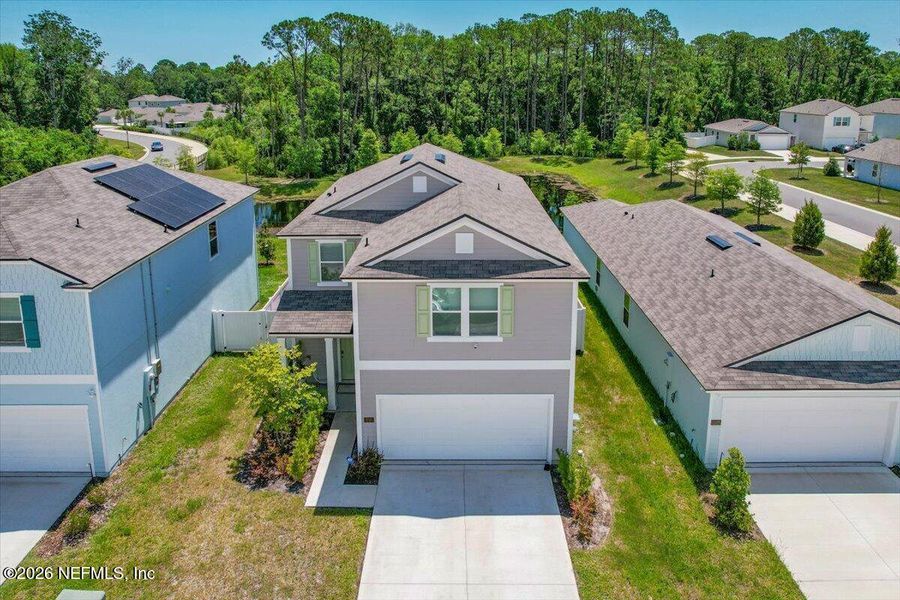 Front exterior of a new home in Ravenswood Village, St. Augustine, FL, highlighting curb appeal (Image 1). Front exterior of a new home in Ravenswood Village, St. Augustine, FL, highlighting curb appeal (Image 1).