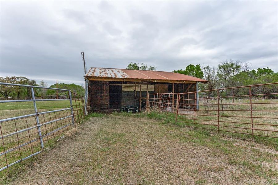 View of outbuilding with an exterior structure and a view of countryside View of outbuilding with an exterior structure and a view of countryside