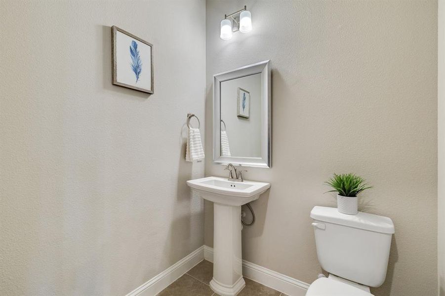 Bathroom featuring tile patterned floors and toilet