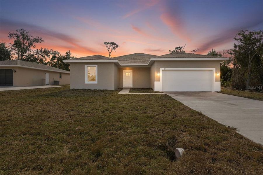 Front exterior of a new home in , Port Charlotte, FL, highlighting curb appeal (Image 24).
