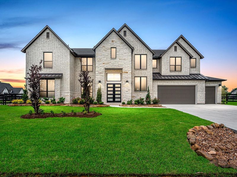 Front exterior of a new home in The Estates at James Lane, Fulshear, TX, highlighting curb appeal (Image 2).