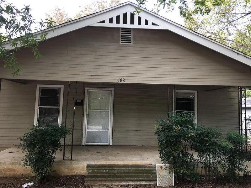 Bungalow-style home with a porch