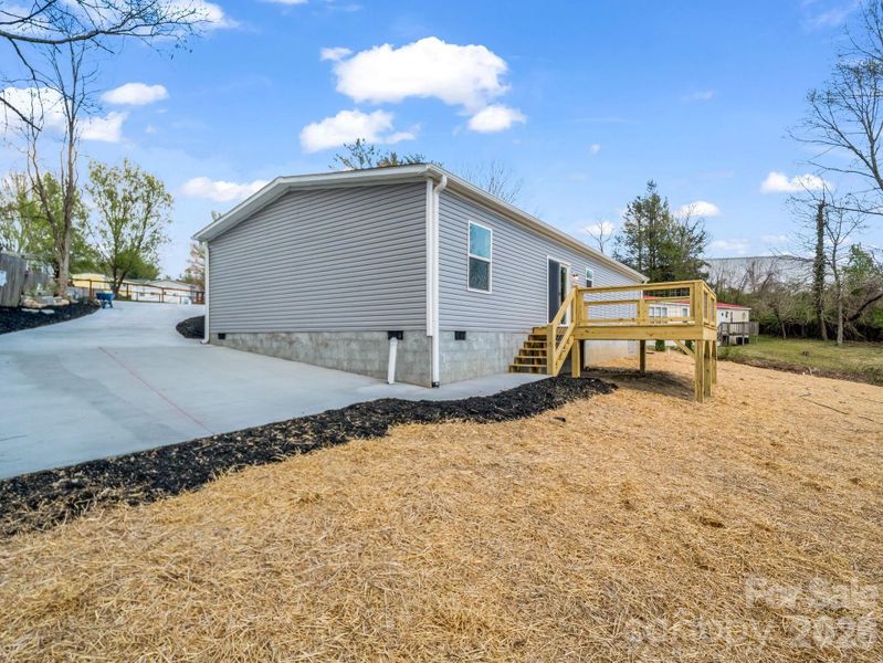 Exterior details and patio area of a home in , East Flat Rock (Image 21).