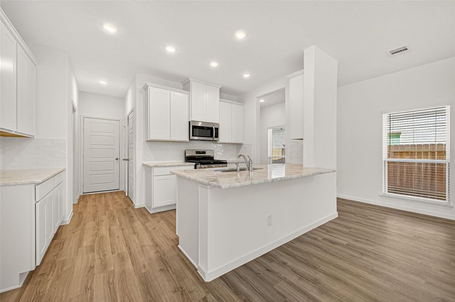 Furnished interior view inside a new home in Mill Creek Trails, Magnolia (Image 9).