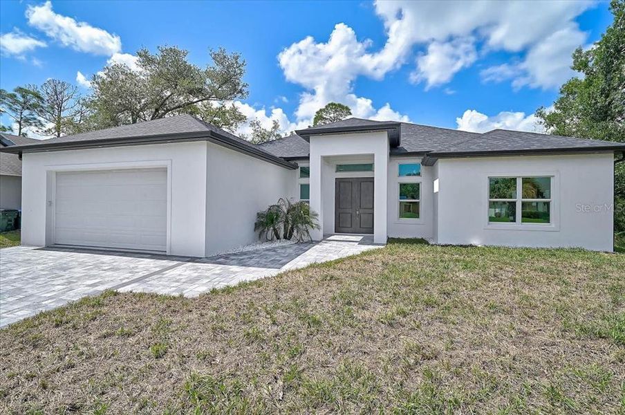 Front exterior of a new home in , North Port, FL, highlighting curb appeal (Image 29).