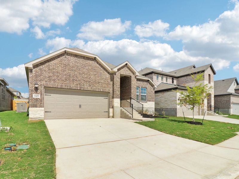 Front exterior of a new home in Sagebrooke - Classic Series, San Antonio, TX, highlighting curb appeal (Image 19). Front exterior of a new home in Sagebrooke - Classic Series, San Antonio, TX, highlighting curb appeal (Image 19).