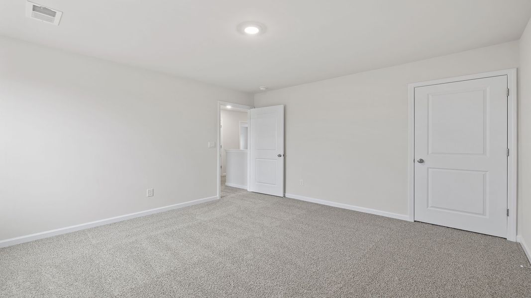 Spacious, unfurnished interior of a new home in Bentley Park, Greenwood (Image 23).