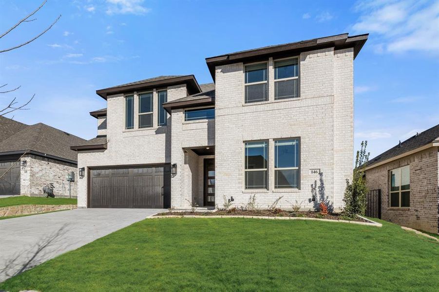 Front exterior of a new home in The Lakes at Parks of Aledo, Aledo, TX, highlighting curb appeal (Image 25).