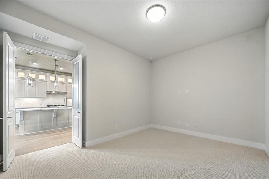 Unfurnished bedroom featuring light colored carpet and recessed lighting Unfurnished bedroom featuring light colored carpet and recessed lighting