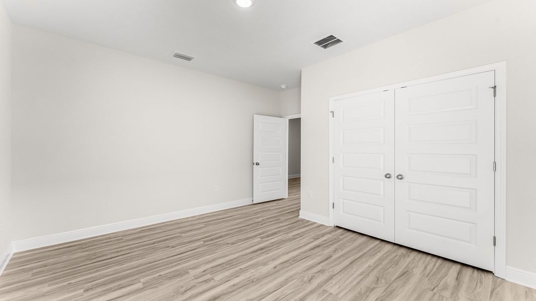 Representative unfurnished interior of a home built from the The Destin by D.R. Horton in Pine Creek and Heron Walk, Port St. Joe (Image 18).