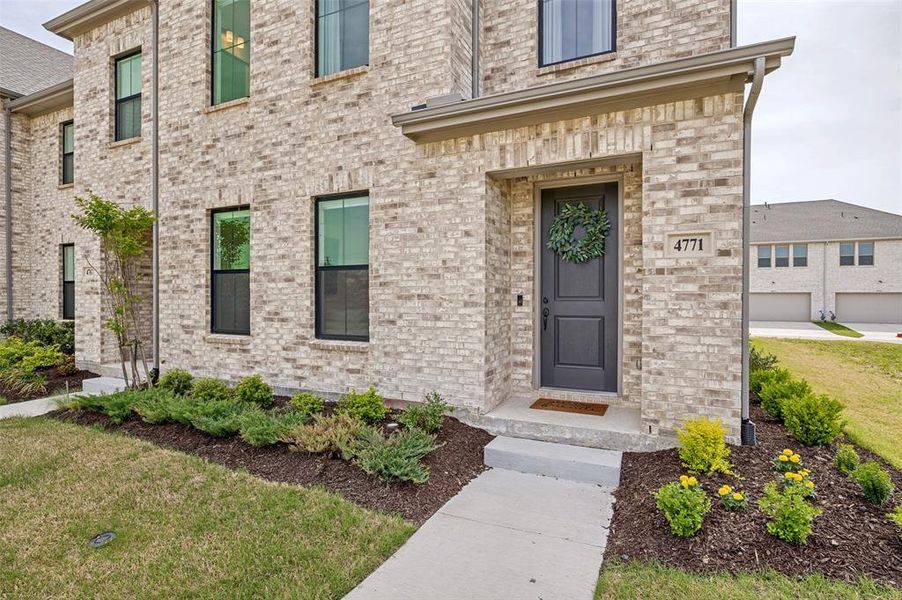 Exterior details and patio area of a home in Painted Tree - Woodland District, McKinney (Image 2).