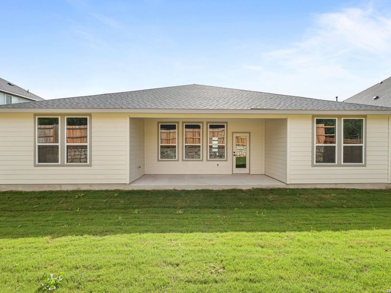 Exterior details and patio area of a home in The Reserve at Potranco Oaks, Castroville (Image 4).