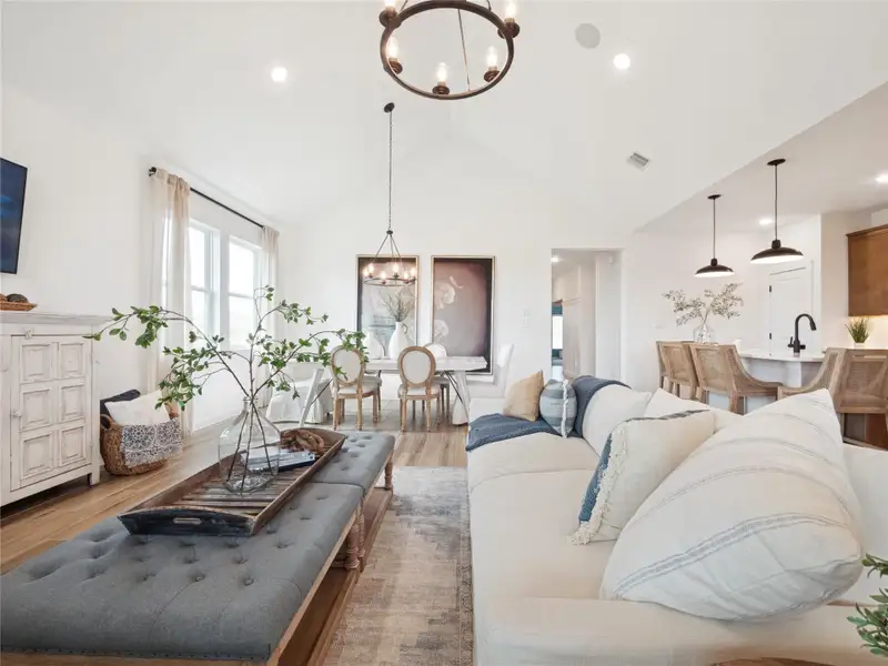 High vaulted ceilings in the great room and dining area (*Photo not of actual home and used for illustration purposes only.)