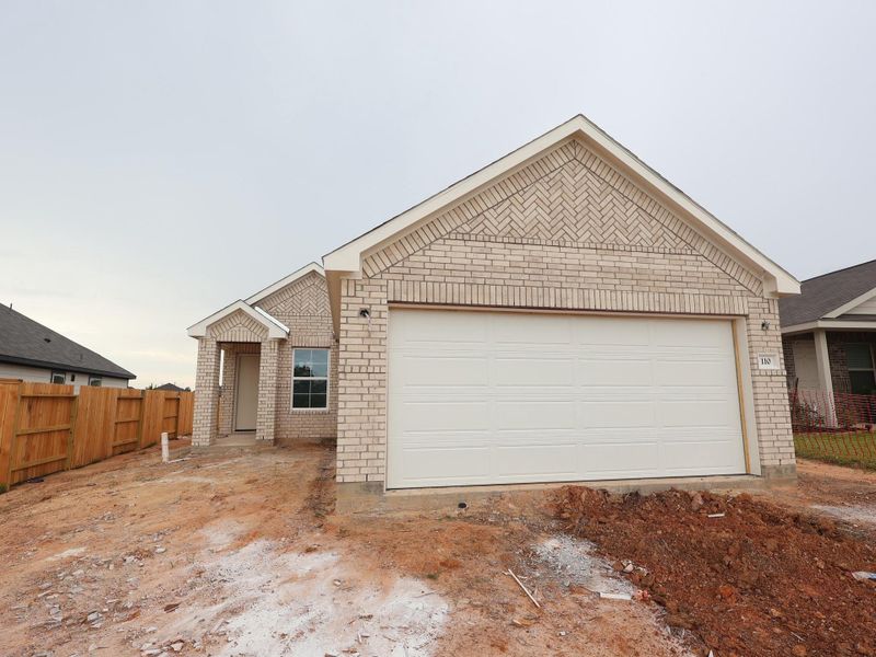 Front exterior of a new home in Magnolia Ridge, Magnolia, TX, highlighting curb appeal (Image 2). Front exterior of a new home in Magnolia Ridge, Magnolia, TX, highlighting curb appeal (Image 2).