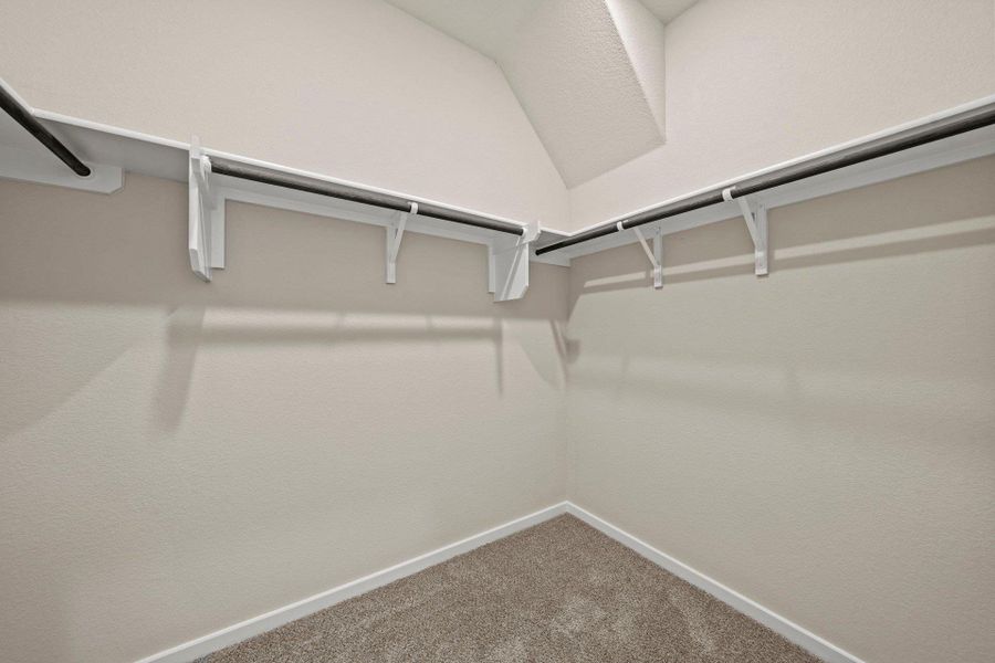 Walk-in closet in Primary Bedroom Walk-in closet in Primary Bedroom