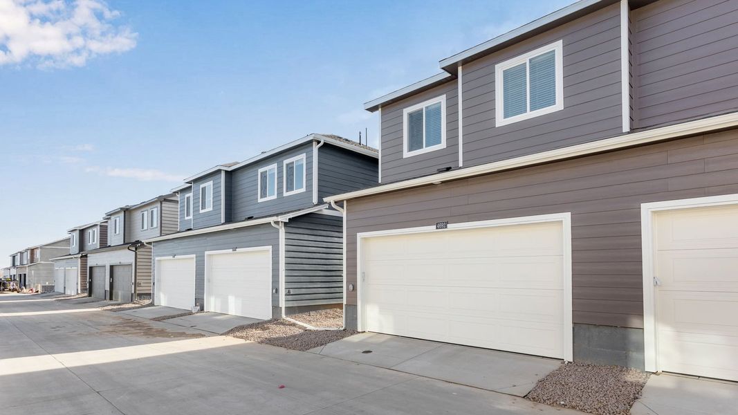 Front exterior of a new home in Revere at Johnstown, Johnstown, CO, highlighting curb appeal (Image 2). Front exterior of a new home in Revere at Johnstown, Johnstown, CO, highlighting curb appeal (Image 2).