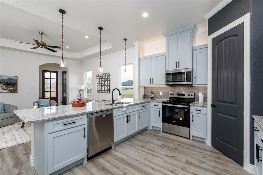 Kitchen opens to living room.