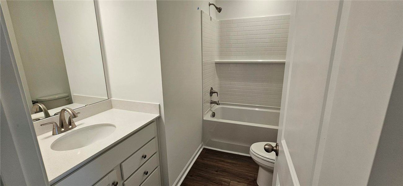 This bathroom features elegant finishes and a clas This bathroom features elegant finishes and a clas