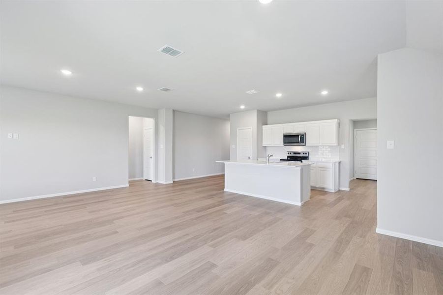 Open Floor Plan in the Harrison home plan by Trophy Signature Homes – REPRESENTATIVE PHOTO Open Floor Plan in the Harrison home plan by Trophy Signature Homes – REPRESENTATIVE PHOTO