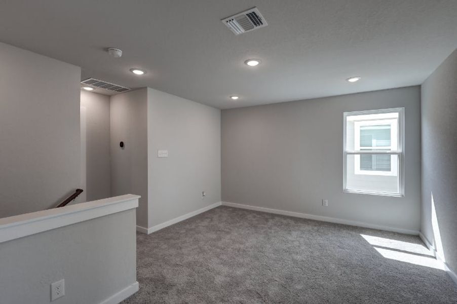 A room with a white wall and a window. A room with a white wall and a window.