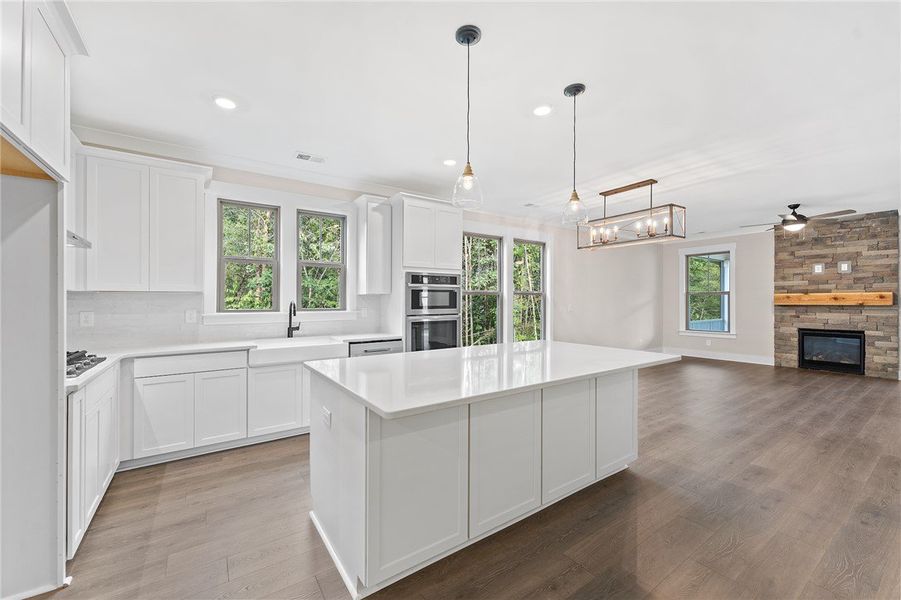 This bright kitchen with a large island flows seam