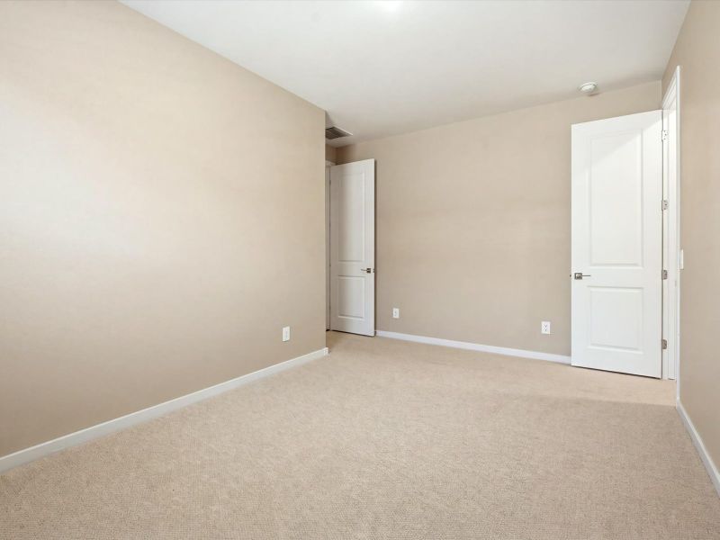 Spacious, unfurnished interior of a new home in White Tank Foothills Signature Series, Waddell (Image 20).
