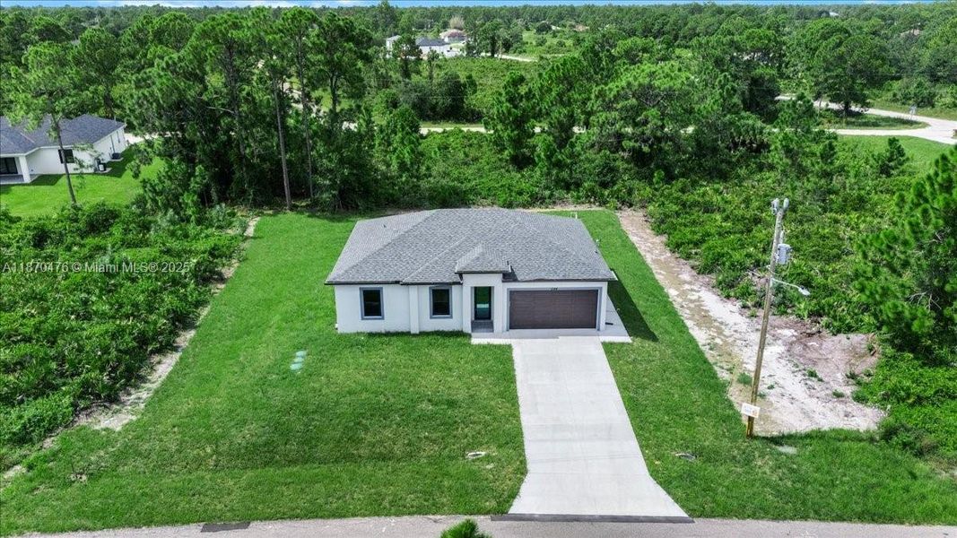 Front exterior of a new home in , Lehigh Acres, FL, highlighting curb appeal (Image 2). Front exterior of a new home in , Lehigh Acres, FL, highlighting curb appeal (Image 2).