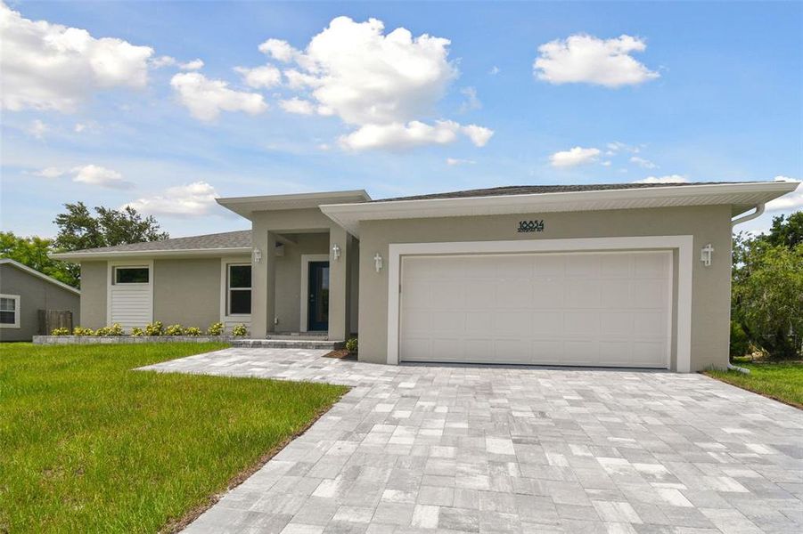 Front exterior of a new home in , Port Charlotte, FL, highlighting curb appeal (Image 1). Front exterior of a new home in , Port Charlotte, FL, highlighting curb appeal (Image 1).