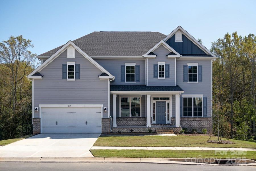 Front exterior of a new home in Oakridge Farms, Mooresville, NC, highlighting curb appeal (Image 1). Front exterior of a new home in Oakridge Farms, Mooresville, NC, highlighting curb appeal (Image 1).