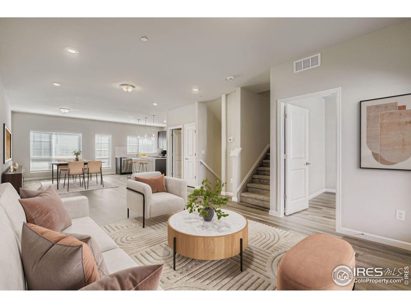 Great Room, dining, and kitchen. Office door on the right, covered balcony behind the camera (level 2) Great Room, dining, and kitchen. Office door on the right, covered balcony behind the camera (level 2)