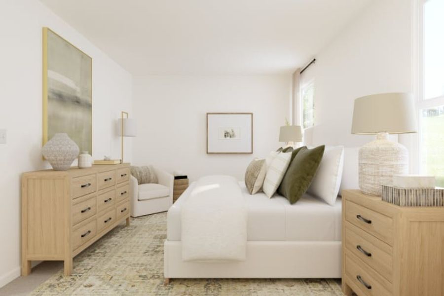 A living room with a white couch and a white table.