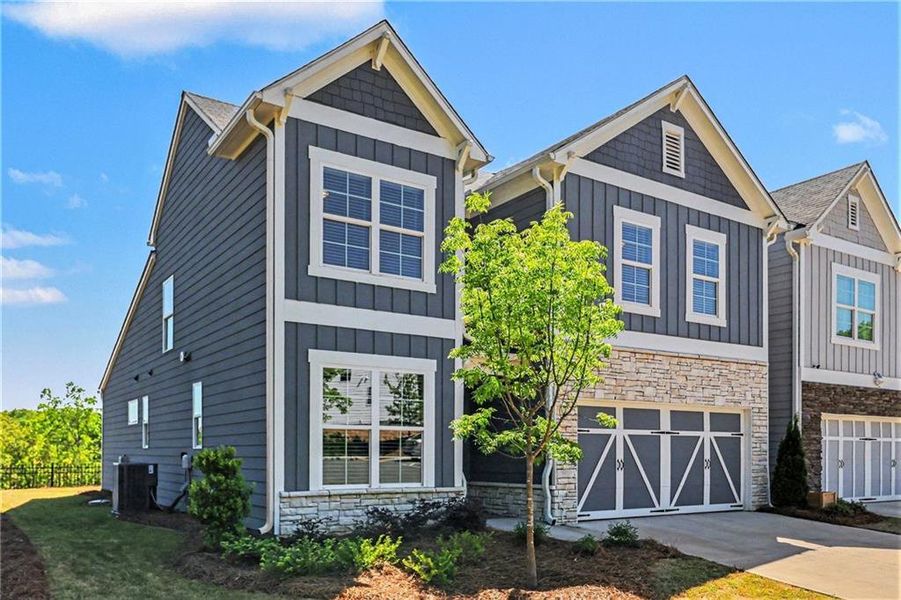 Front exterior of a new home in , Canton, GA, highlighting curb appeal (Image 22).