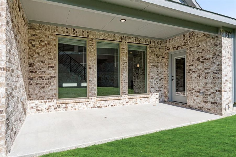 Exterior details and patio area of a home in The Enclave at Parks of Aledo, Aledo (Image 23). Exterior details and patio area of a home in The Enclave at Parks of Aledo, Aledo (Image 23).
