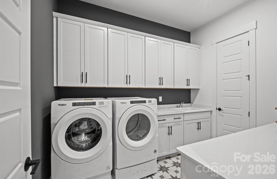 First Floor Laundry Room Features Cabinetry, Sink and Folding Space. Small Storage Closet off of Laundry Room. Representative Photo First Floor Laundry Room Features Cabinetry, Sink and Folding Space. Small Storage Closet off of Laundry Room. Representative Photo