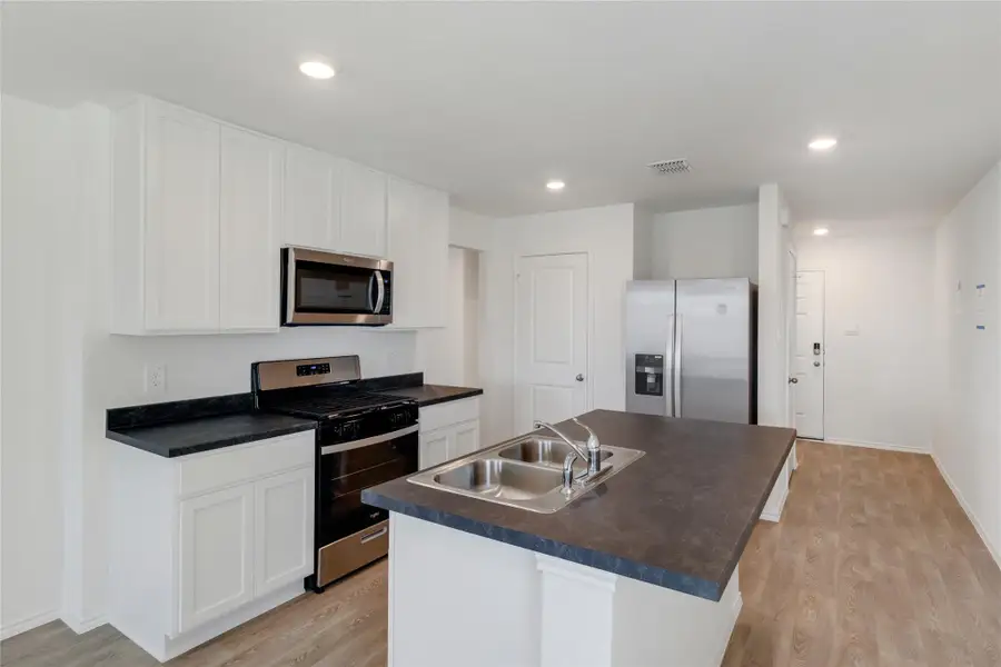 Furnished interior view inside a new home in Prairie Lakes, Buda (Image 9).
