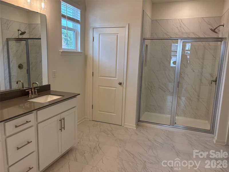 Beautiful Primary bath with dual sinks at vanity.