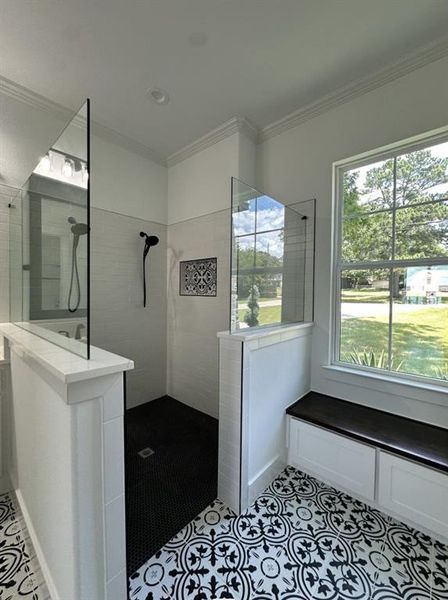 Full bathroom with walk in shower, ornamental molding, and tile patterned floors Full bathroom with walk in shower, ornamental molding, and tile patterned floors