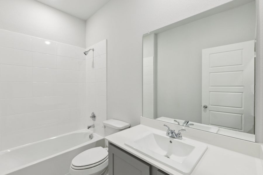Bathroom in the Holden home plan by Trophy Signature Homes – REPRESENTATIVE PHOTO Bathroom in the Holden home plan by Trophy Signature Homes – REPRESENTATIVE PHOTO