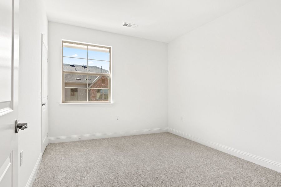 Spacious, unfurnished interior of a new home in The Tribute, The Colony (Image 36).