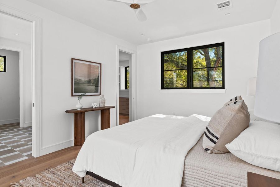 The spacious master suite hosts a sizable bedroom, a large bathroom and a cavernous closet.