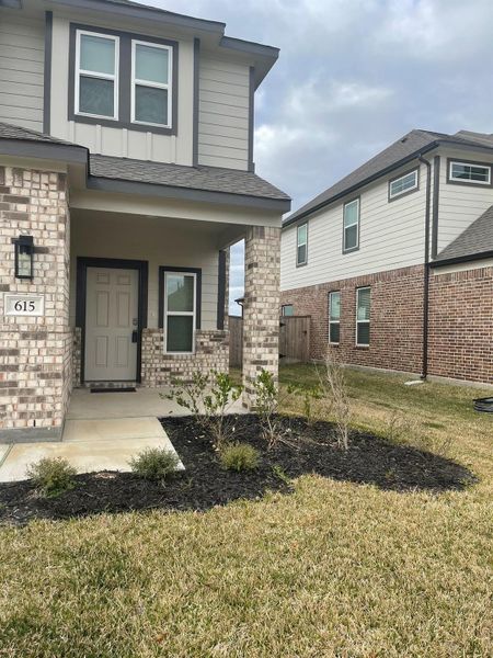 Front exterior of a new home in Huntington Place, Rosharon, TX, highlighting curb appeal (Image 19).